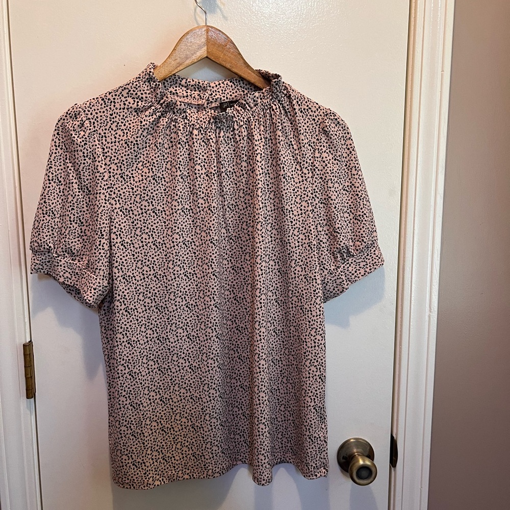NWT short sleeve, ruffle neck top. Cheetah print. Soft fabric.